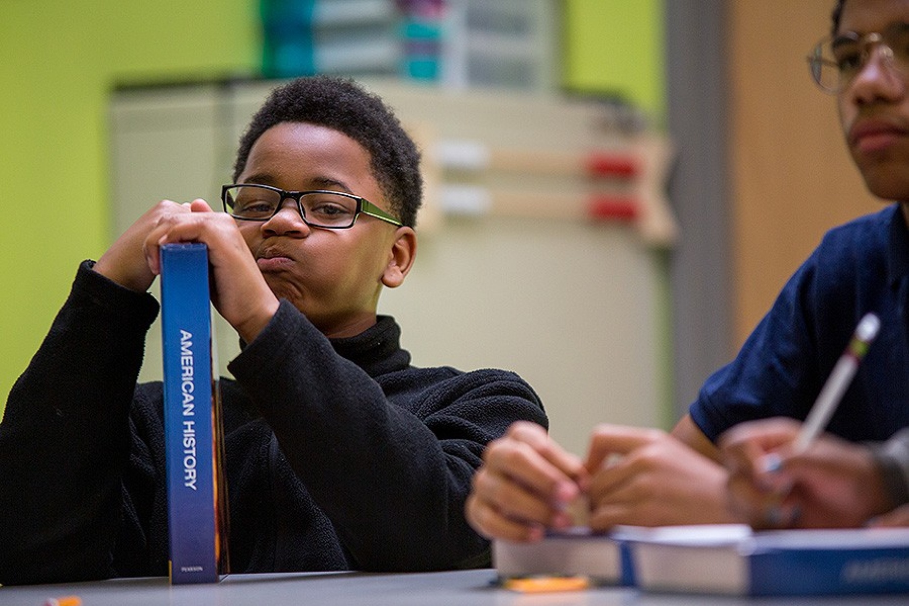 Young student looking bored during a history lession.