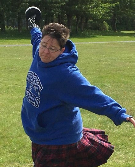 Kathryn Kendall throwing the light weight for distance. 