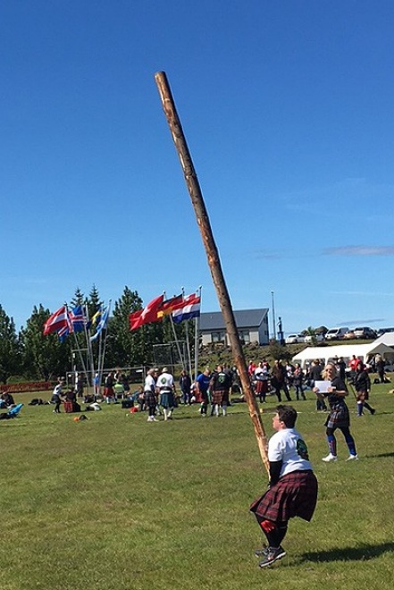Karthryn Kendall participating in the caber toss. 