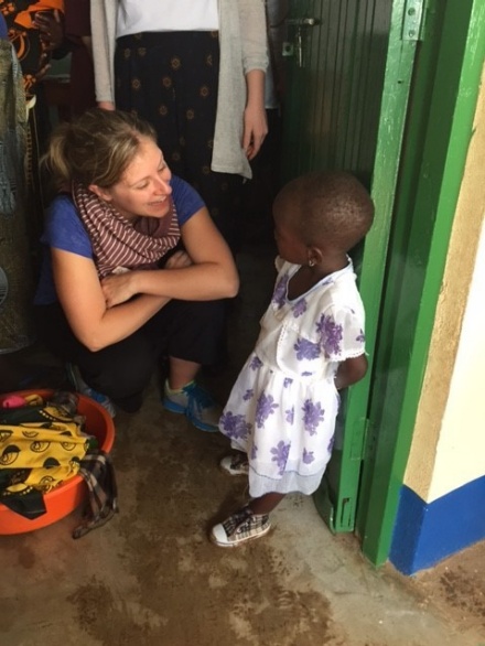 Alison Balind, then a UB MSW student from Canada, speaks with a local student during a trip to Tanzania in January 2016. 