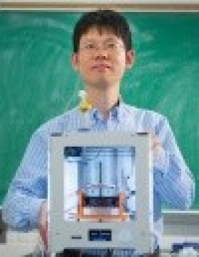 headshot of Chi Zhou. 