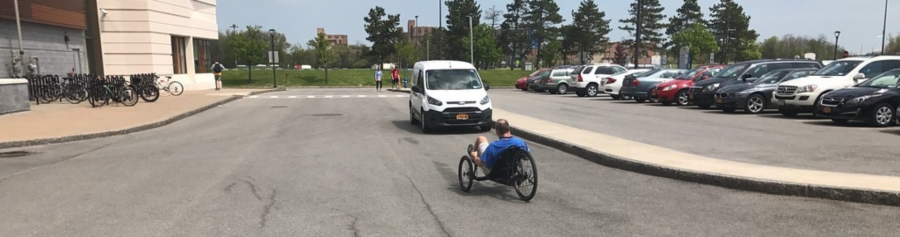 Curt Senf tests out his new trike in the Furnas parking lot outside Jarvis Hall on UB’s North Campus. 