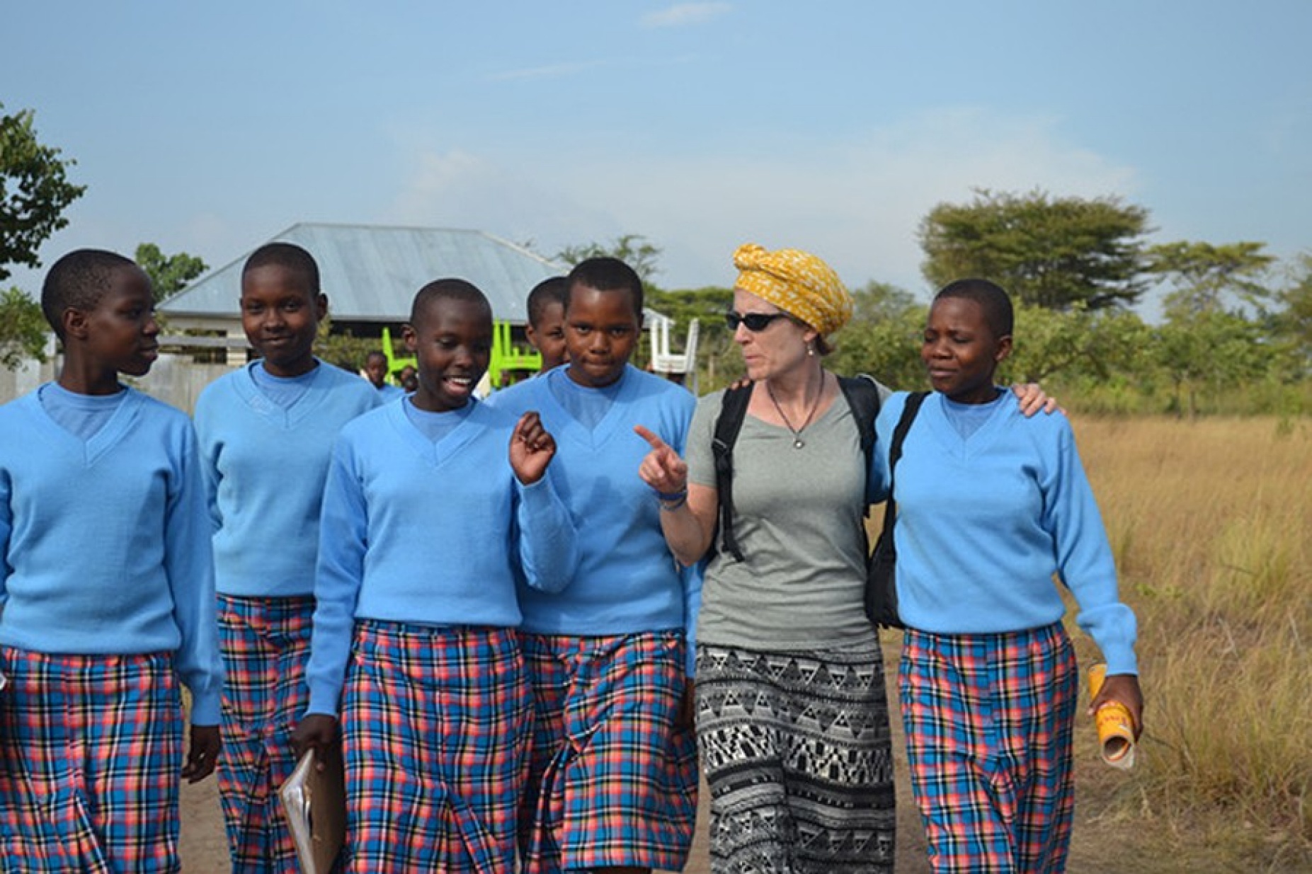 GEC Executive Director Anne Wadsworth with Kitenga students, learning about their day.