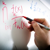 Mathematical equation on a white board. 