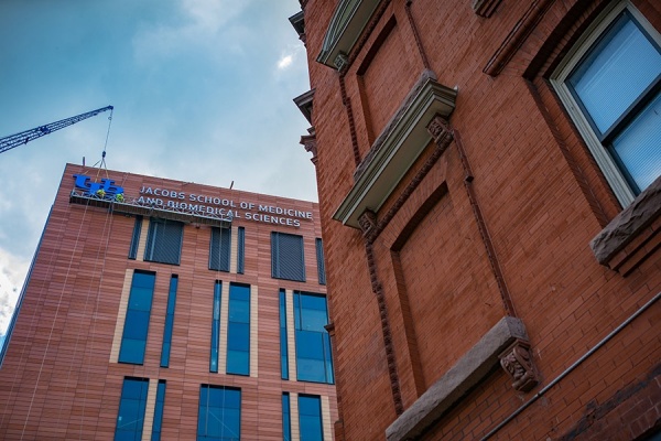 Zoom image: The UB logo is installed on the side of the building. Photo: Douglas Levere 