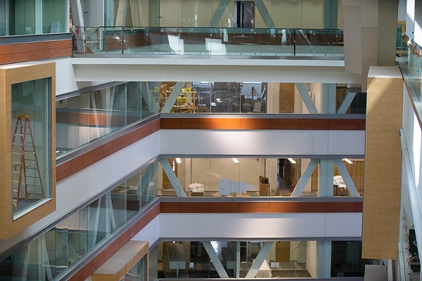 Zoom image: The atrium will invite collaboration and foster a sense of community among faculty, students and staff as they navigate around their new home. Photo: Douglas Levere 
