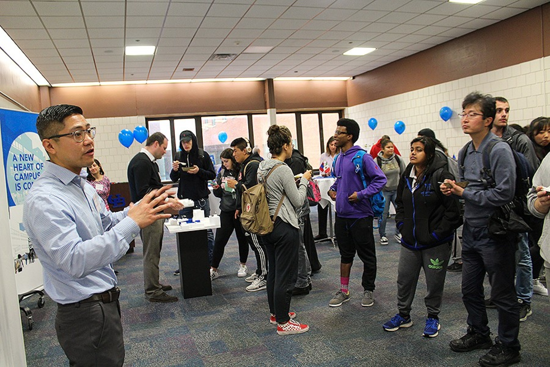 Peter McCarthy, AIA, LEED AP, associate vice president for Cannon Design, who also holds an M.Arch degree from UB, presents information the global market caf&eacute; to UB students during focus groups presented by Cannon on Wednesday in the Student Union on UB&rsquo;s North Campus. 