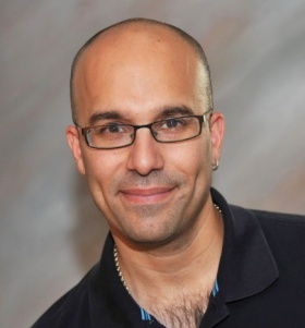 headshot of Omer Gokcumen. 