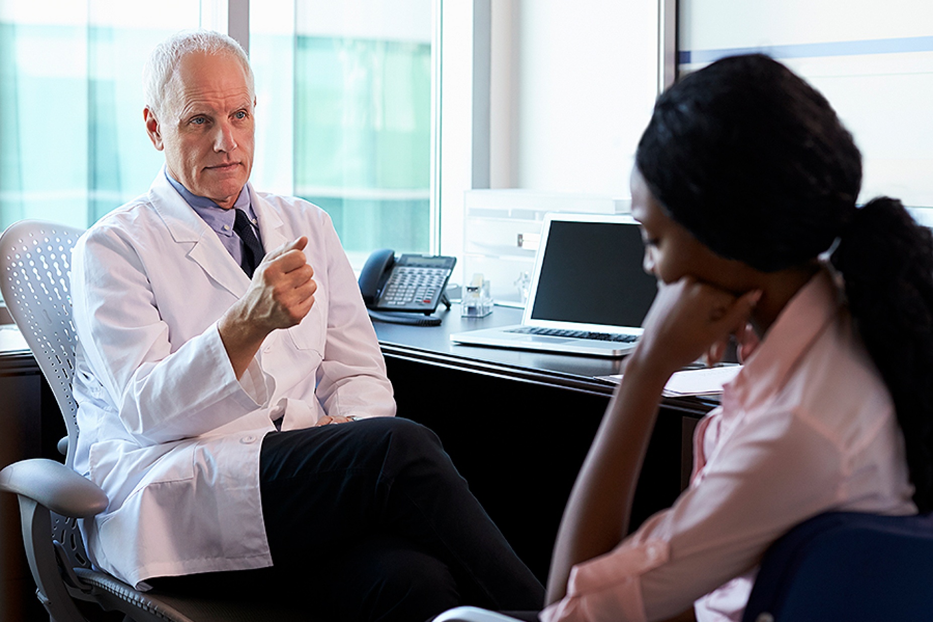 Doctor speaking to a patient. 