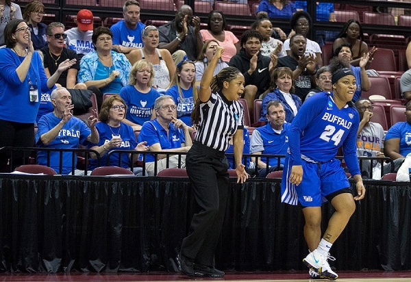 Zoom image: Junior guard Cierra Dillard takes a bow after sinking a three-point shot in the second half. Photo: Mark Wallheiser 