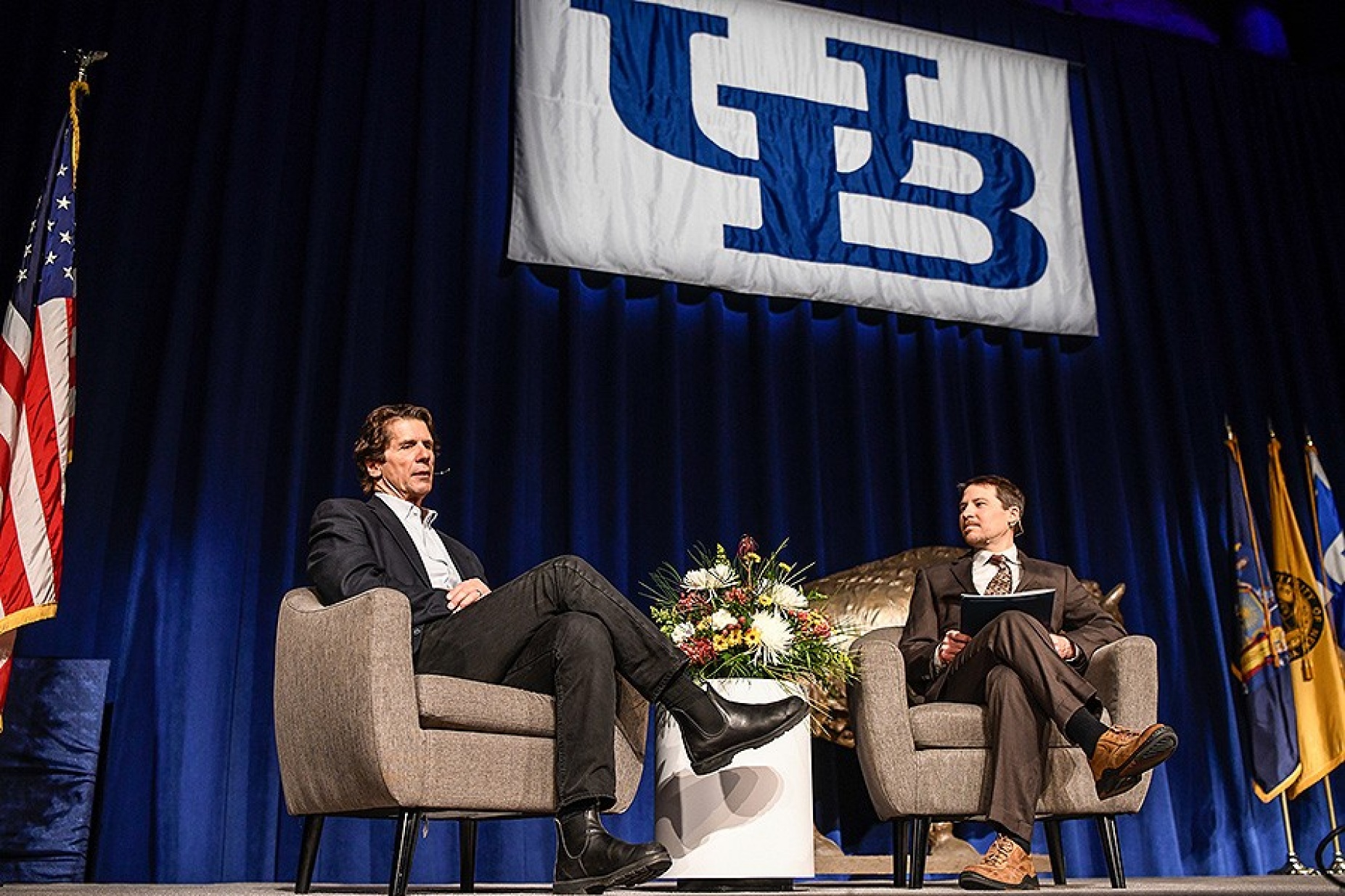 James Balog (left) and Jason Briner, associate professor in the Department of Geology and moderator of the event, continue the discussion after Balog’s lecture. 
