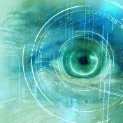 Digital image of globe with big data text against close up human eye. 