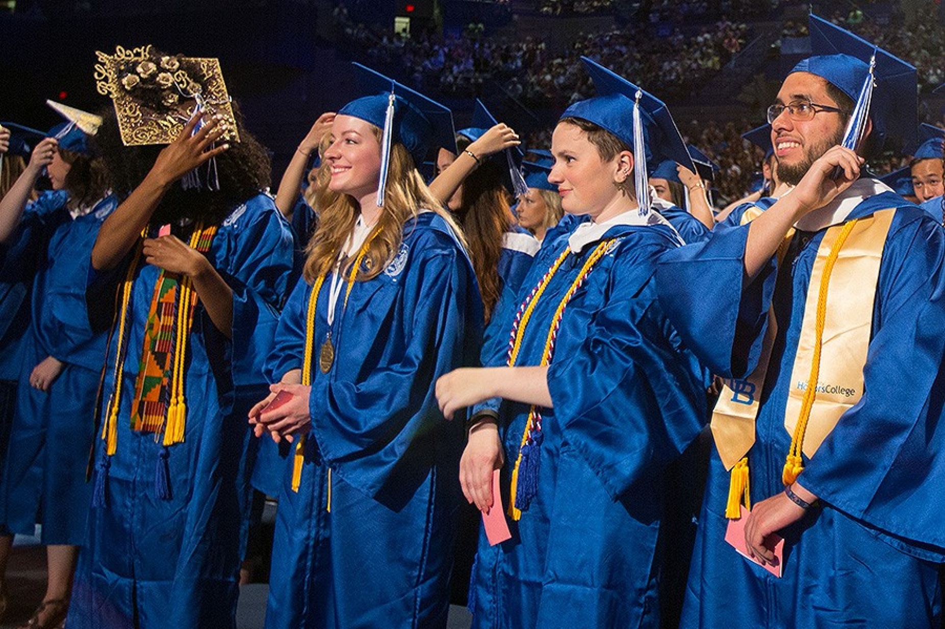 2017 graduates turn their tassels from the right to left side of their caps after receiving their diplomas. 
