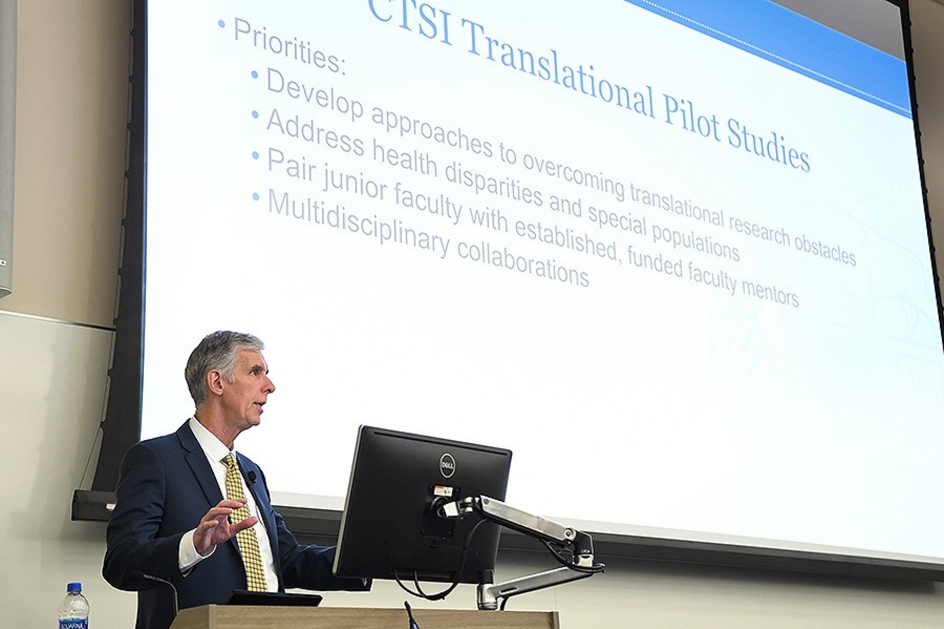 Dr. Timothy Muphy at the podium during the CTSI Annual Forum. 