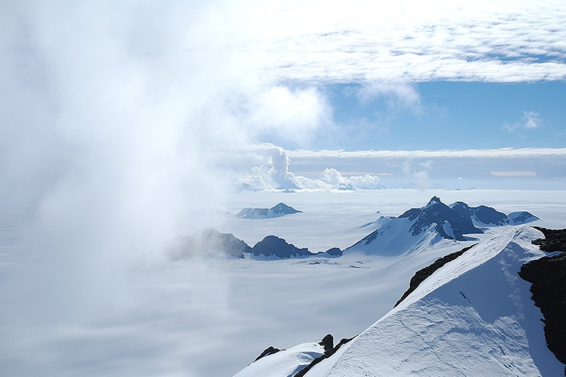 Summer clouds swirl in around the Staccato Peaks of Alexander Island, Antarctic Peninsula. 