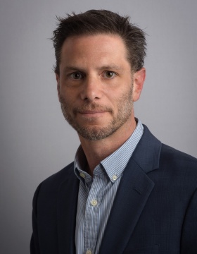 portrait of UB psychology professor Derek Daniels. 