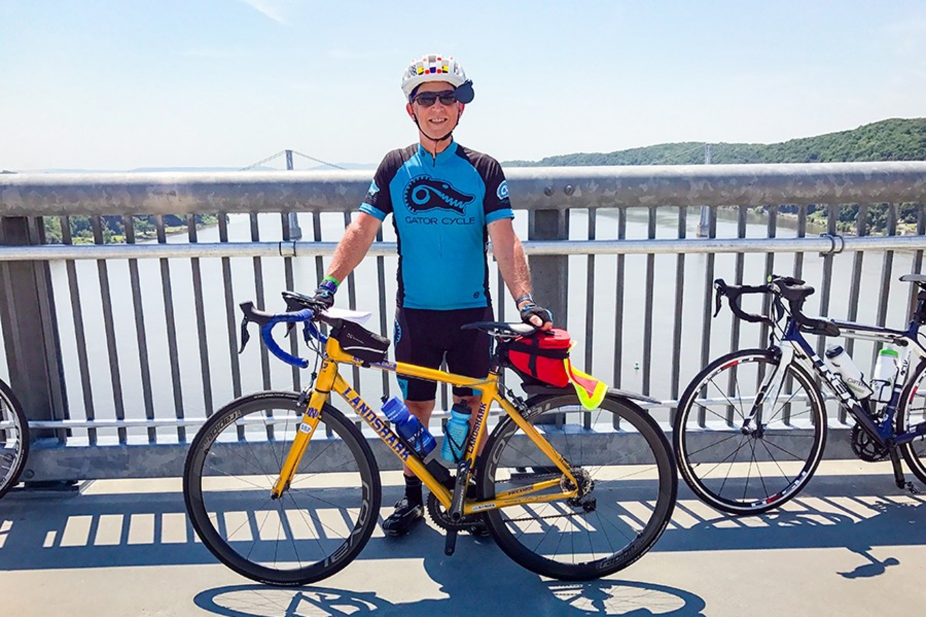 David Brown with his bike on a bridge overlooking the Hudson River during the 2017 Empire Ride. 
