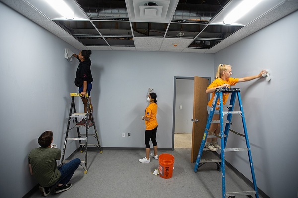 Colin Douglas, Ariyana DeWitz, Kelly Luo, and Emily Van Skyock work to fix things up at the Jericho Road Community Health Center.