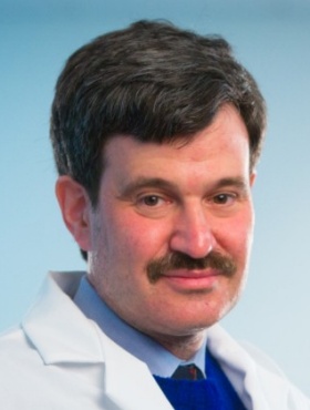 headshot of Andrew Talal. 