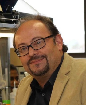 headshot of Panayotis “Peter” Thanos. 