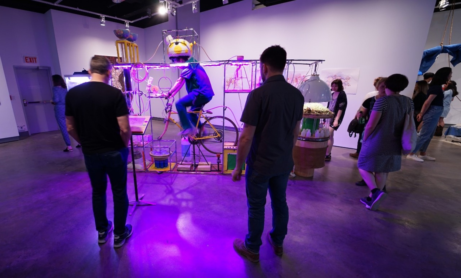 person on a bike in a performance of Remediation Station.