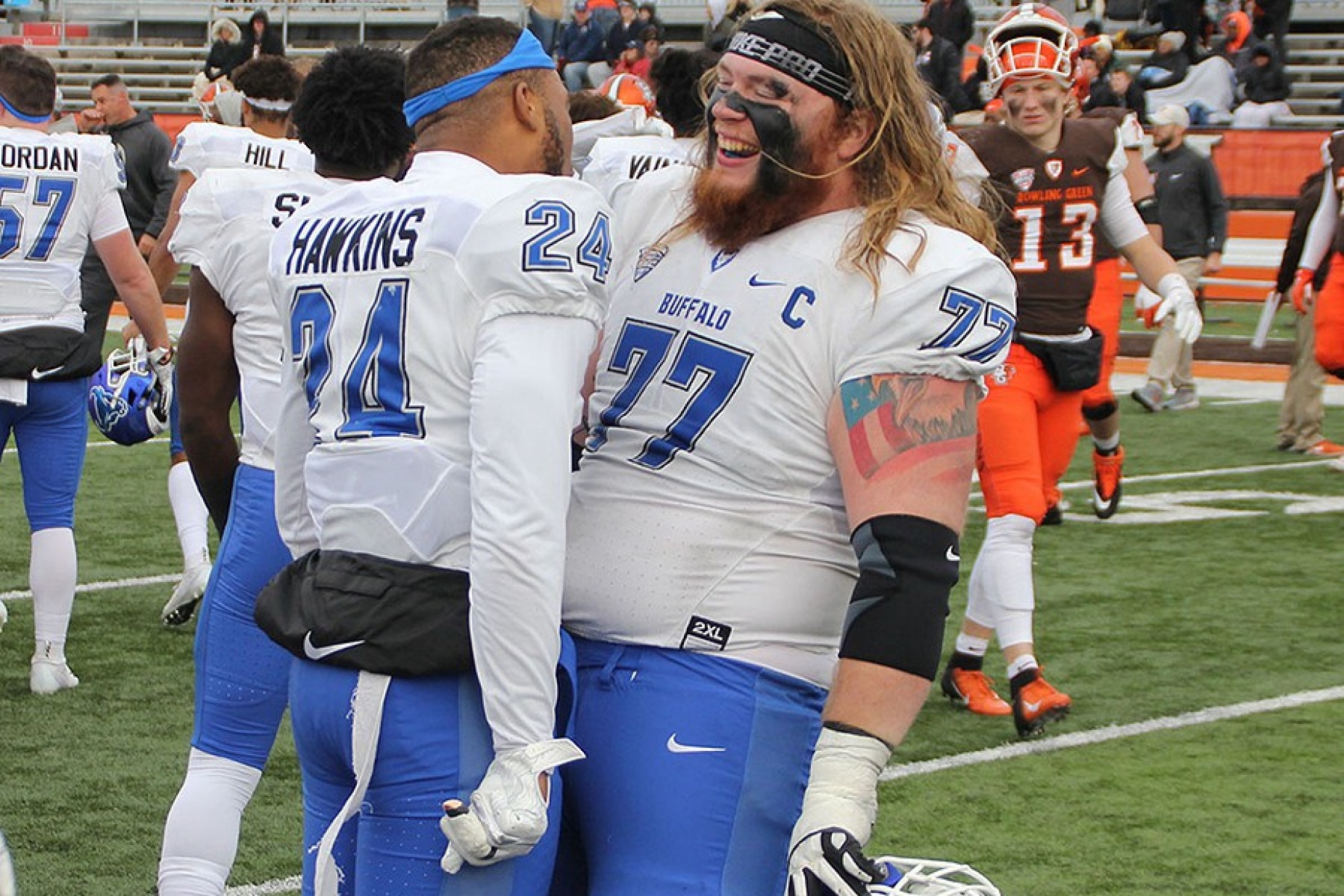 Two UB Bulls players celebrate advancing to MAC Championship game. 