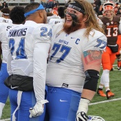 Two UB Bulls players celebrate advancing to MAC Championship game. 