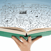 Close up of female hand holding open book. 