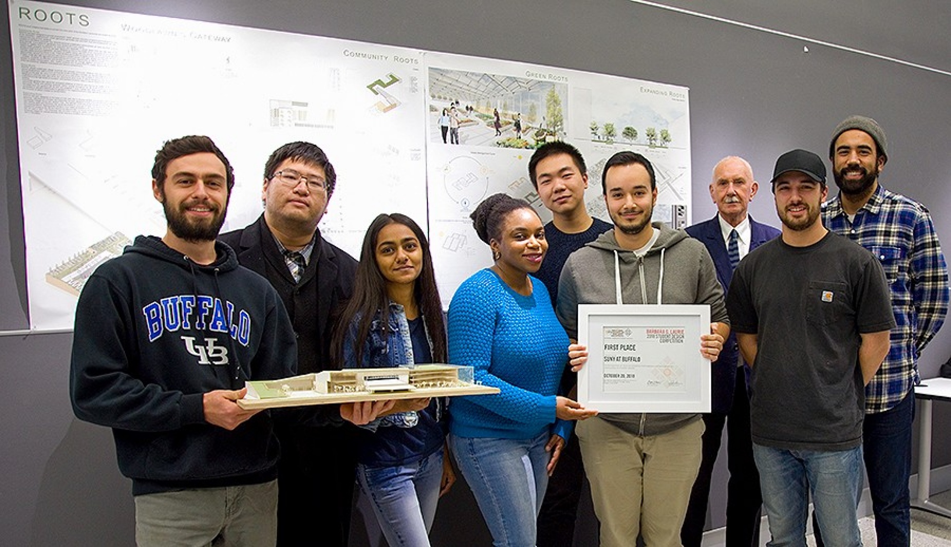 The UB NOMAS team stands with their first place award. Architecture professor Brian Carter (fourth from left) is the organization's faculty mentor. 