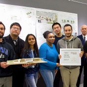 The UB NOMAS team stands with their first place award. Architecture professor Brian Carter (fourth from left) is the organization's faculty mentor. 