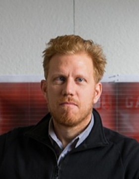 Headshot of Christopher Romano. 