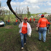 Volunteers at a site of a natural disaster. 