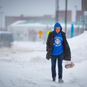 Student walking in a snowstorm. 