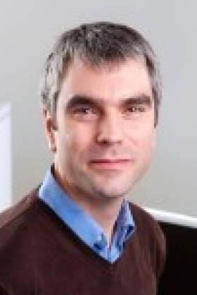 headshot of Fraser Sim. 