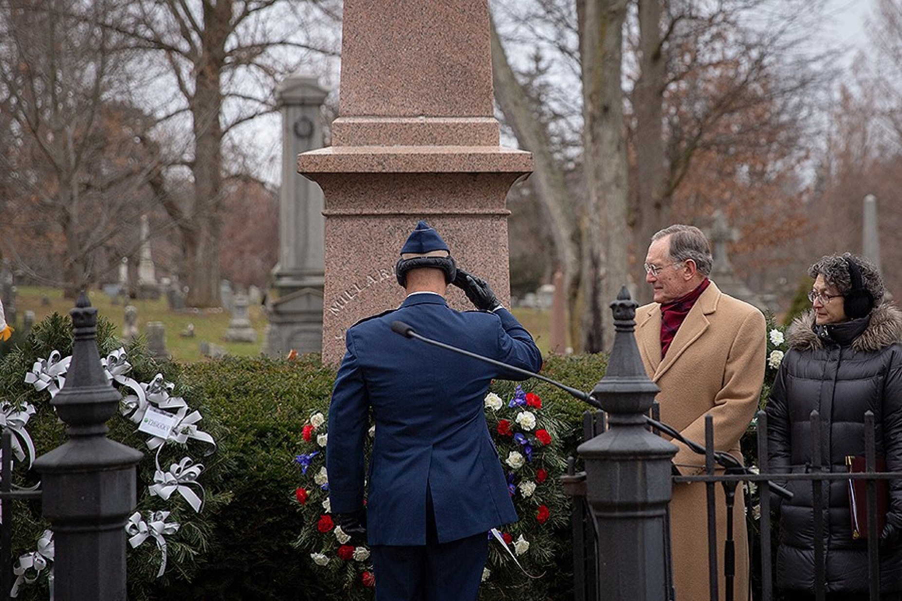 A military officer salutes during the annual Millard Fillmore commemoration ceremony. 