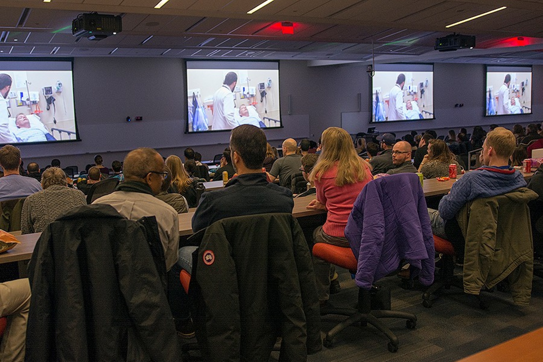 Attendees watch the documentary "Do No Harm" in the M&T Auditorium in the medical school.