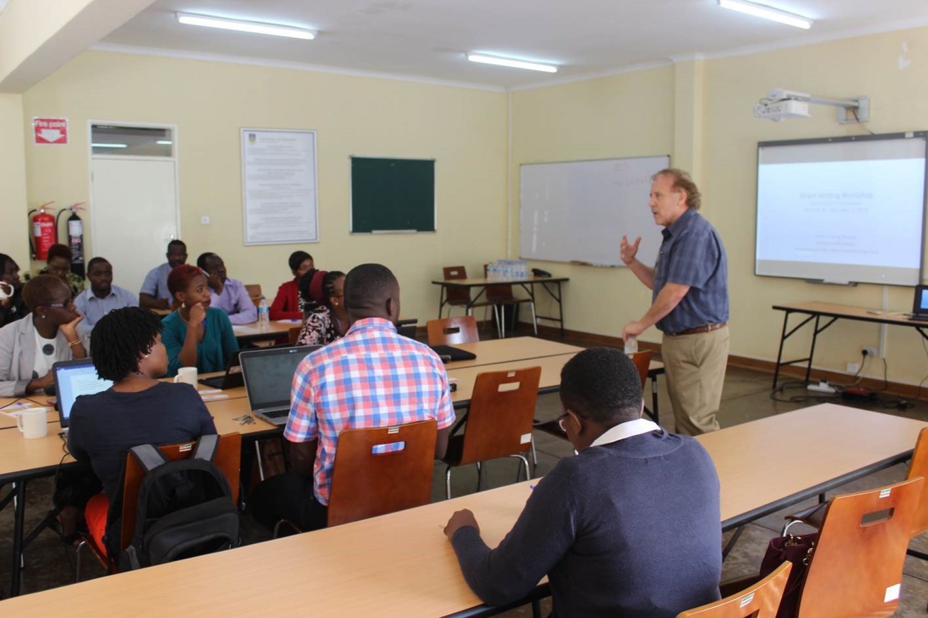 Gene Morse in a classroom leading a grant-writing workshop for University of Zimbabwe faculty.