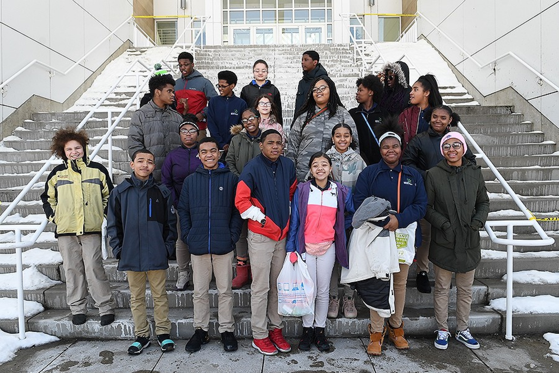 Eighth grade students from Enterprise Charter’s Junior Frontiers of the Mohawk Valley program pose together on the steps of the Center for the Arts on UB's North Campus. 