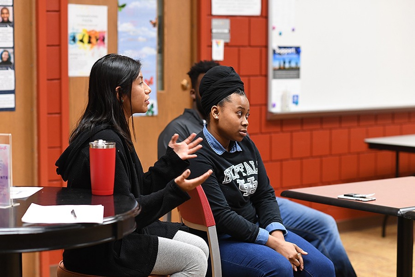 Alexandra Torres, a senior in International Studies, spoke to eighth graders of finding "the passion that I have" pertaining to her studies, suggesting that they each do the same.