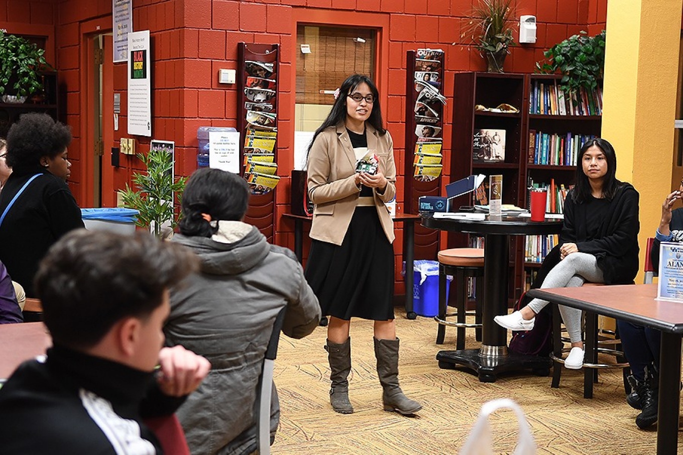 Destiney Placa, a first year grad student, spoke about women getting into tech fields and presented her "raspberry pi" as she walked about the group of eighth graders.