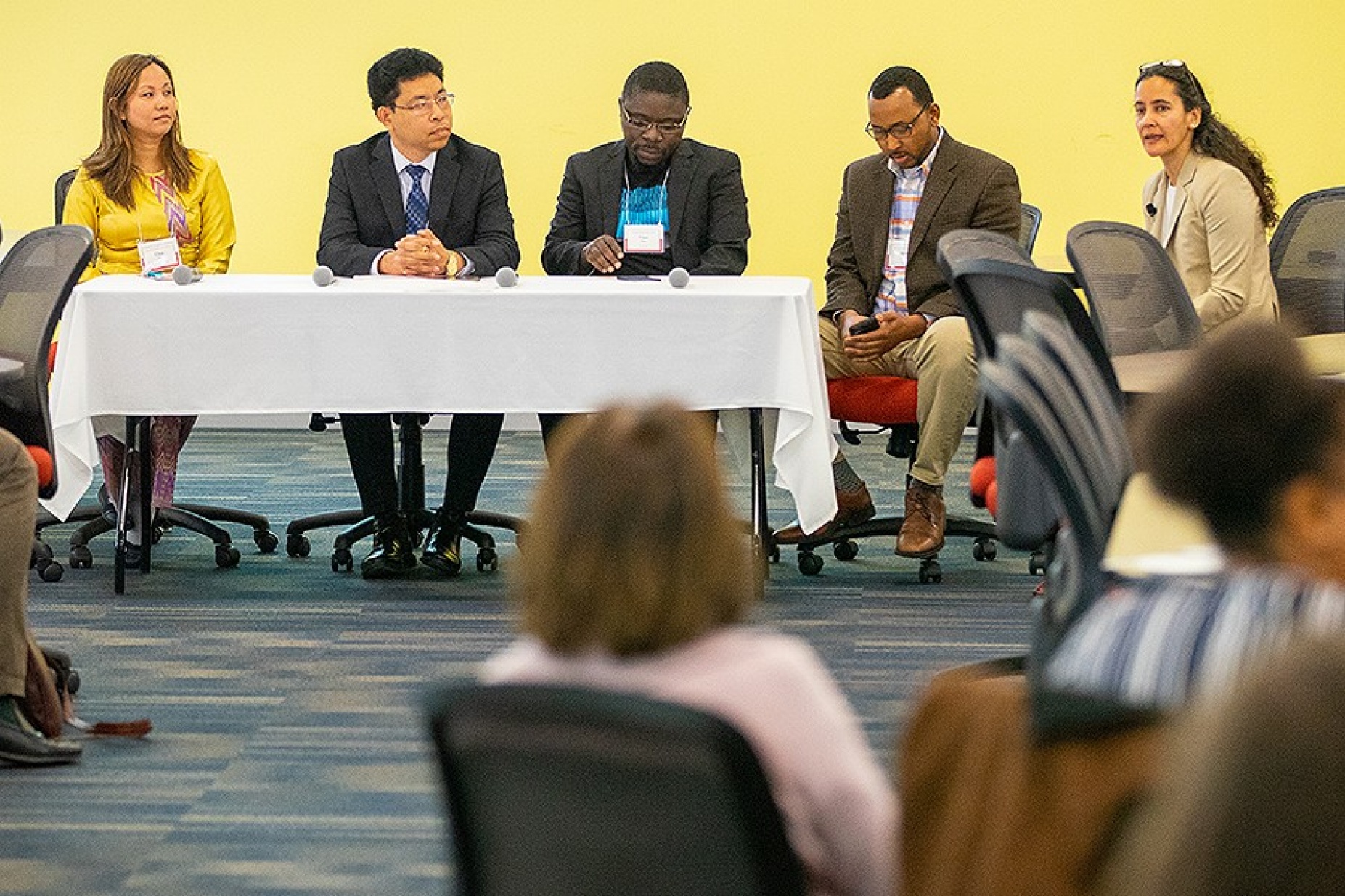 Four refugees lead a panel discussion of their experience when they relocated to Buffalo, NY.