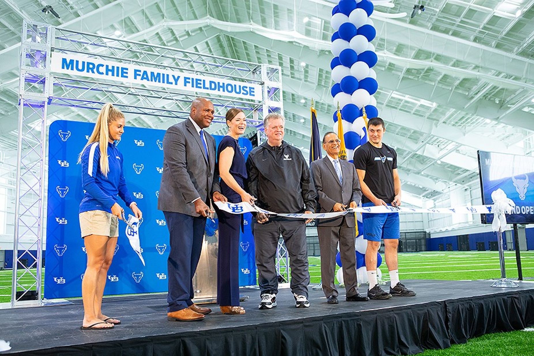 Ribbon cutting ceremony for the Murchie Family Field House. 