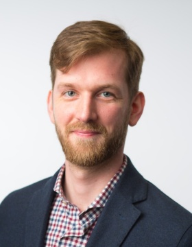 headshot of Ryan Muldoon. 