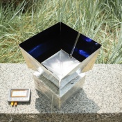 The system helps cool its surroundings by absorbing heat from the air inside the box and transmitting that energy through the Earth’s atmosphere into outer space. 