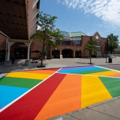 Rainbow crosswalk across Putnam Way looking from the Student Union toward UB Commons. 