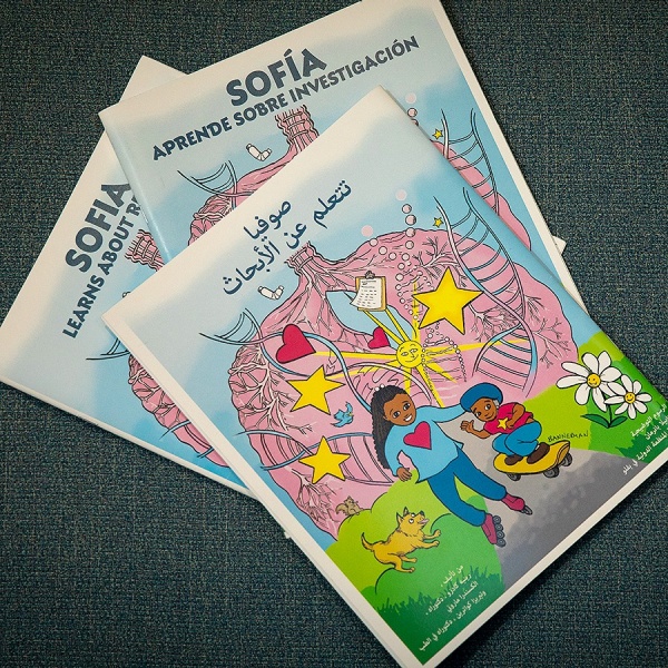 Zoom image: &quot;Sofia Learns About Research&quot; coloring books are available in English, Spanish and Arabic from UB's Clinical and Translational Science Institute. Photo: Meredith Kulwicki 