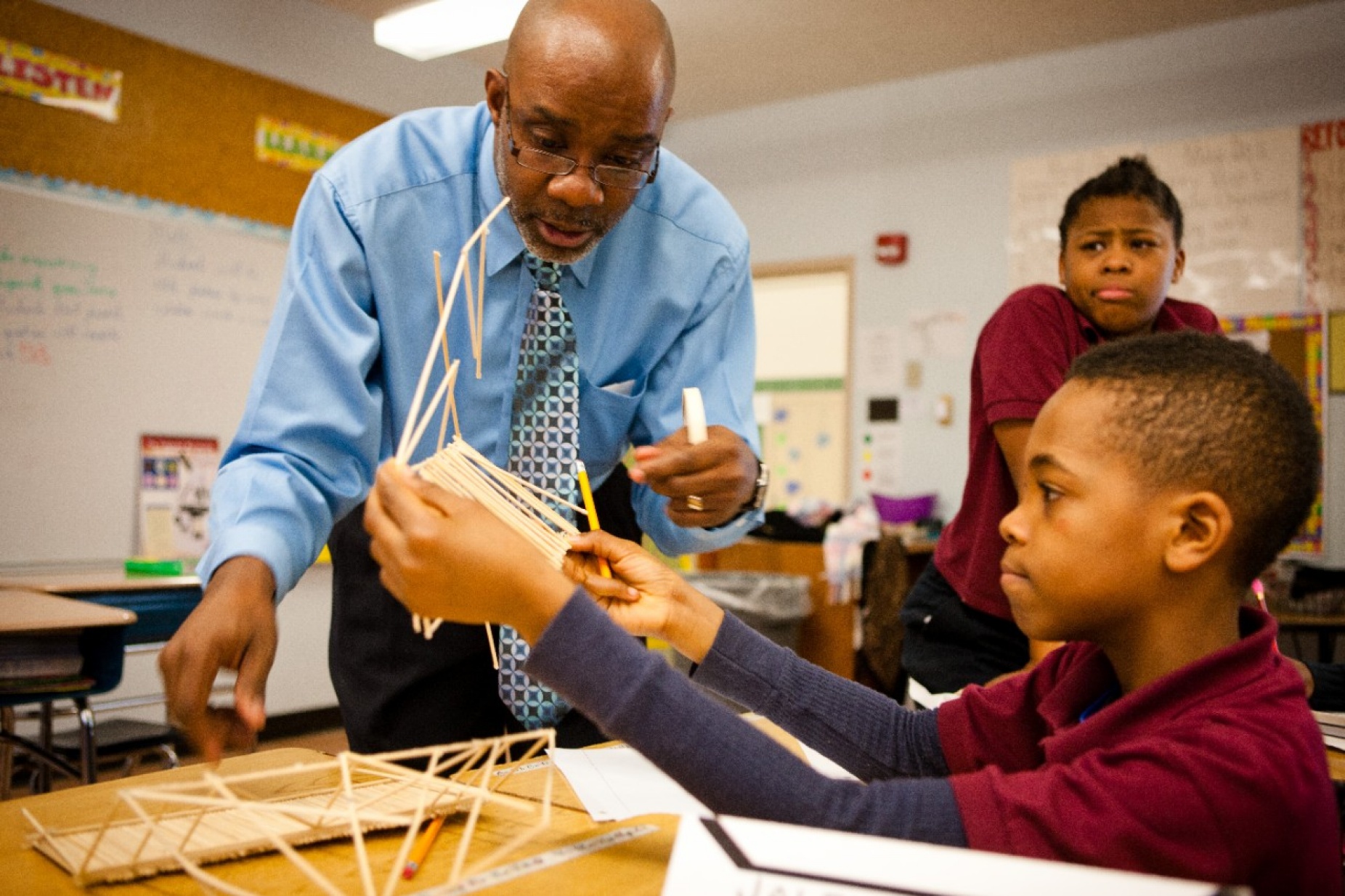 Teacher working with young students. 