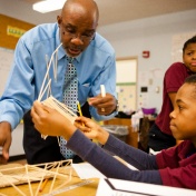 Teacher working with young students. 