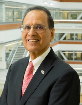 UB President Tripathi in the Jacobs School of Medicine and Biomedical Sciences building. 
