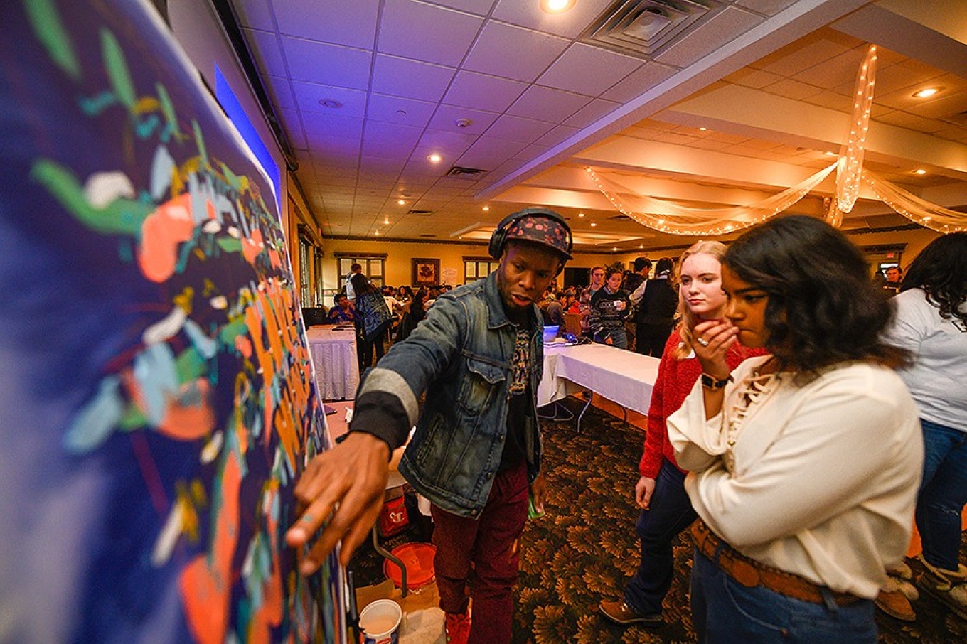 XX speaking with local high school students during the Challenge 2 Change summit. 